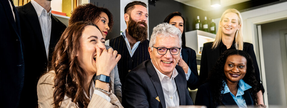Multiracial business team sharing laughter and positivity during a casual office meeting. Real joy, connection, and authentic human interaction in a modern corporate setting. Team bonding concept. - Powered by Adobe