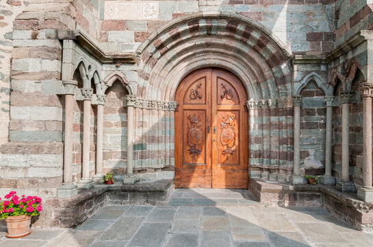 Ancient wooden entrance door at the Chapel of Sacra di San Michele, or or St. Michael Abbey, province of Turin, Piedmont, Italy