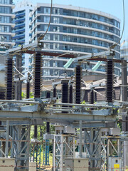 High Voltage Transmission Tower with Glass Insulators, Industrial Infrastructure Against Blue Sky
