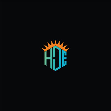 Elegant HDE Monogram Logo with Radiant Sunburst on Deep Black Canvas