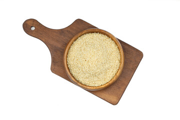 Top view closeup of freshly harvested white sesame in wooden bowl isolated on white background with...