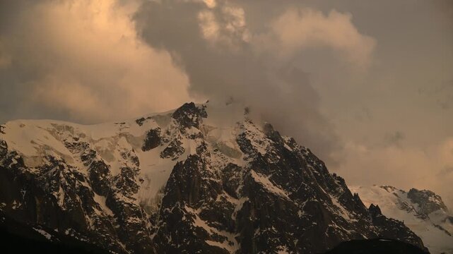 Timelapse of clouds rolling over the jagged peaks at the Aiguille du Midi and Mont Blanc