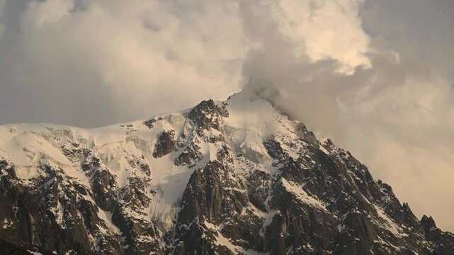 Timelapse of clouds rolling over the jagged peaks at the Aiguille du Midi and Mont Blanc