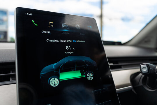 Charging status display shows the charge level of the electric car at the outdoor electric station. Future energy concept