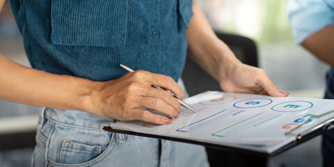 Sustainability and ESG. Professional discussing environmental strategies in a modern office.