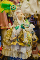 Souvenirs in the vetrina. Kepamic figurines of dolls, cats, decorative toys