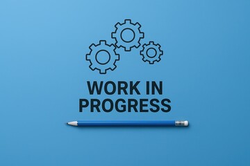 Work in Progress Concept with Gears and Pen on Blue Background for Creativity.