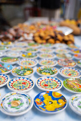 Colorful ceramic souvenirs on market stall