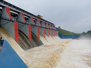 Water rushing through gates at a dam 