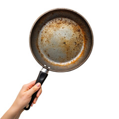 a hand holds a heavily stained frying pan isolated on white png