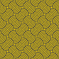 Yellow and gray concentric circles creating geometric pattern