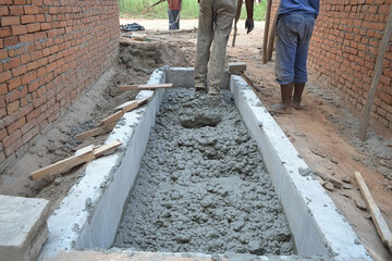 Pouring concrete for formwork in construction project