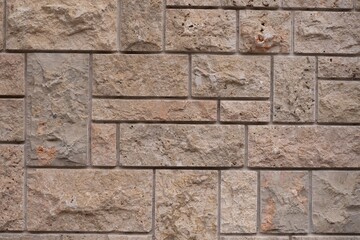Close-up View of Beige Natural Stone Wall Texture