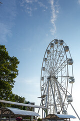 ferris wheel on a blue sky in the park