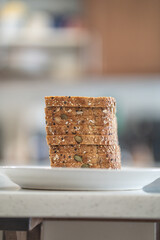 a pile of slices of whole grain bread