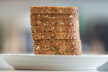 a pile of slices of whole grain bread