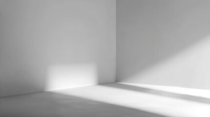 A bright, minimalist corner room with strong light and shadows