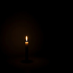 a lone, slender white candle stands upright in the profound darkness, its single flame casting a small,