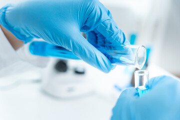 Scientist analyze biochemical sample in advanced scientific laboratory. Medical professional check...