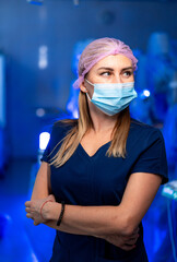 Healthcare worker in sterile environment. A healthcare professional stands confidently in a...