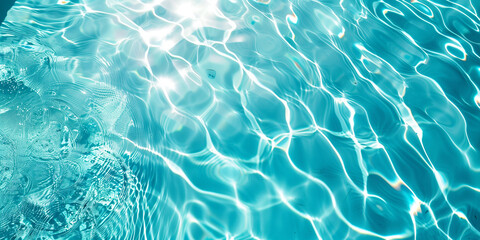 Turquoise water surface with ripples reflecting sunlight in swimming pool