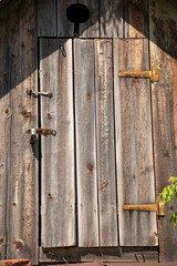 A wooden door with a lock on it