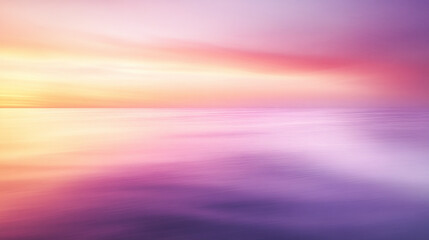 Sunset over a calm ocean with a soft blur on the left side for text overlay.