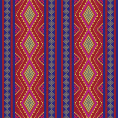 Ethnic abstract art seamless pattern  red and blue background design for carpet,curtain,clothing,fabric,wrapping paper,tiles,textiles,batik,texture and wallpaper.Vector background.
