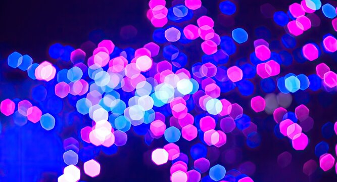 Abstract bokeh image featuring a multitude of out-of-focus, hexagonal lights in shades of pink, blue, and purple against a dark background, creating a vibrant, energetic, 