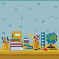 Colorful desk with school supplies and globe in a study environment  