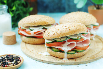 Bun sandwiches with salami and vegetables