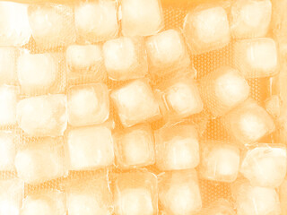 Frozen texture with ice cubes for background. The background yellow of ice cubes is white with a fresh nuances background concept.