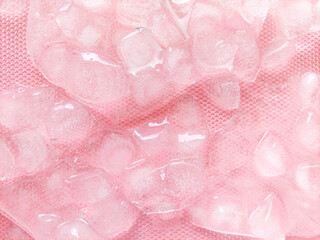 Top view frozen ice cubes on pink background. A set of transparent ice cubes, no shadow, ice cube...