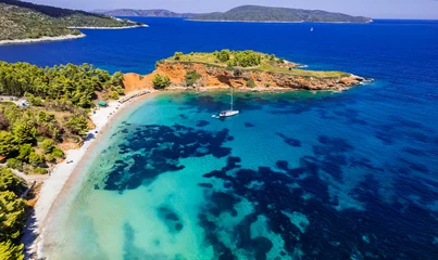 Gordijnen Greece travel, green picturesque Sporades. Alonissos island beast scenic beaches - Kokkinokastro aerial drone view of oragnge rocks and turquoise sea © Freesurf