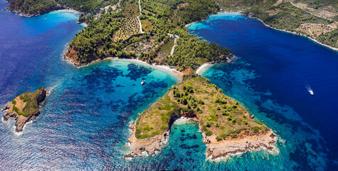 Greece, green picturesque  Sporades. Alonissos island beast scenic beaches - Kokkinokastro and Chrisi Milia, aerial drone high angle view. greek summer destination