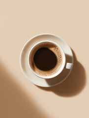 Top-down view of espresso cup on beige background
