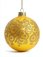 Ornate gold Christmas ornament with filigree pattern on white background