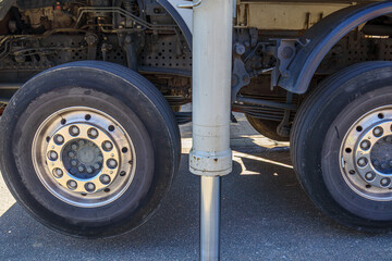 Close-up of support leg stabilizer cylinder for cement truck in operation, hydraulic cylinder used to provide stable support, found on construction equipment, heavy machinery and trailers
