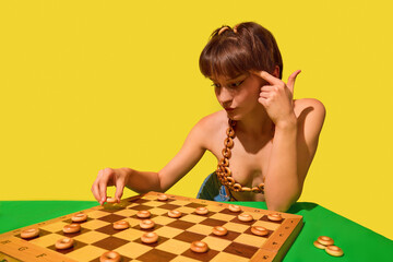 Focused woman playing checkers with bread rings in surreal food-themed board game. Concept of...