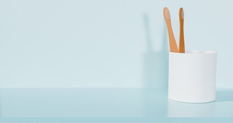 Wooden toothbrush and toothbrush holder in white with a light blue background