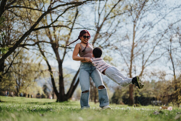 A joyful mother enjoys spinning her child playfully on a sunny day in the park. The scene captures...