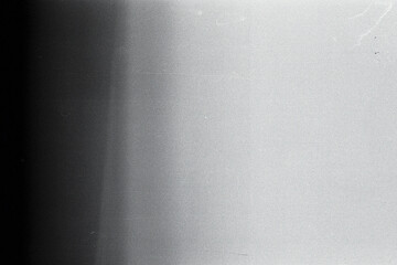 Blank grained film strip texture background with heavy grain, dust and light leak