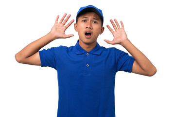 Shocked young asian delivery man wearing blue uniform isolated on white background