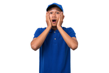 Shocked young asian delivery man wearing blue uniform isolated on white background