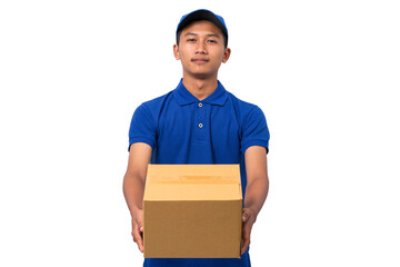 Smiling young asian delivery man wearing blue uniform holding cardboard box on white background