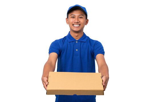 Smiling young asian delivery man wearing blue uniform holding pizza box on white background
