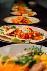 These colorful tacos, filled with fresh shrimp and peppers, are garnished with lime and perfect for any meal