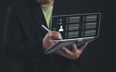 Business professional using digital tablet to select candidate profiles from evaluation interface, representing smart recruitment, employee selection, HR decision-making process in business hiring.