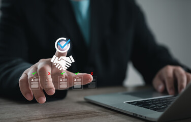 Executive making recruitment decision by selecting a candidate profile with a handshake and checkmark icon, representing hiring approval, HR process, and digital employee evaluation system.
