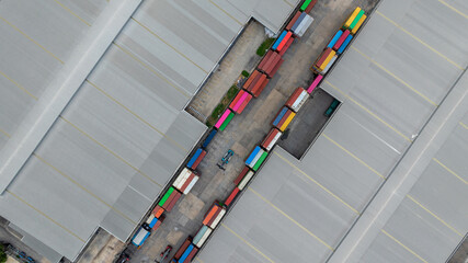 Aerial view semi truck cargo trailer at logistic park warehouse goods, Distribution warehouse...